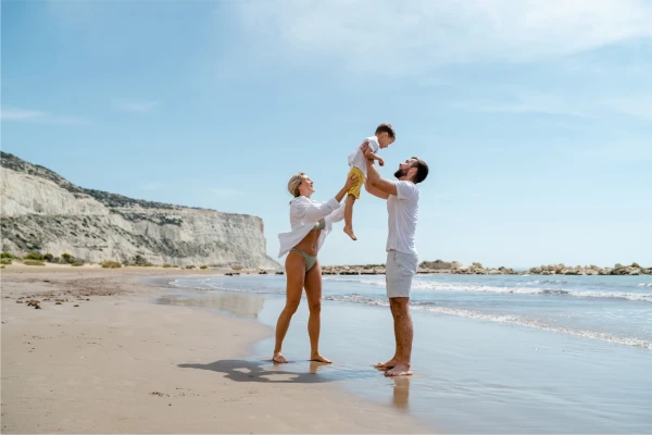 Family playing together on a beach vacation